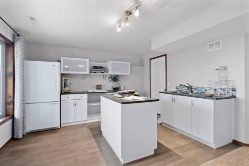 16 Bow Ridge Drive, Cochrane, AB - Indoor Photo Showing Kitchen