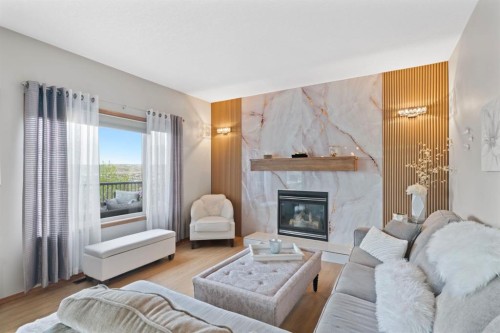 16 Bow Ridge Drive, Cochrane, AB - Indoor Photo Showing Living Room With Fireplace