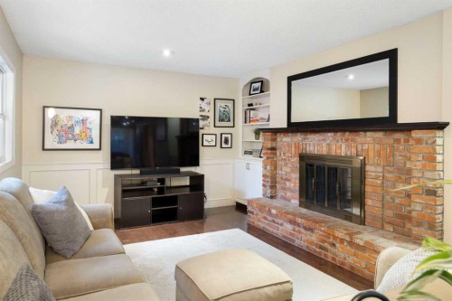 111 Lake Mead Place Se, Calgary, AB - Indoor Photo Showing Living Room With Fireplace