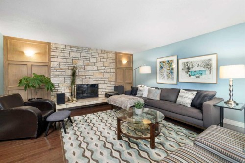 111 Lake Mead Place Se, Calgary, AB - Indoor Photo Showing Living Room With Fireplace