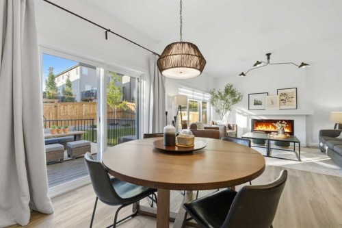 92 Heritage Hill, Cochrane, AB - Indoor Photo Showing Dining Room With Fireplace