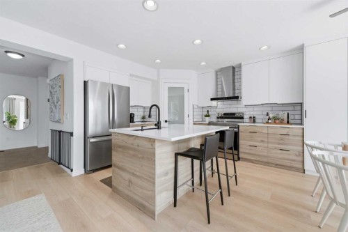 91 Bridleridge Crescent Sw, Calgary, AB - Indoor Photo Showing Kitchen With Stainless Steel Kitchen With Upgraded Kitchen