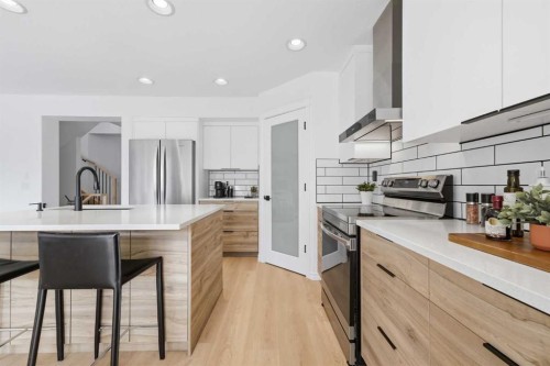 91 Bridleridge Crescent Sw, Calgary, AB - Indoor Photo Showing Kitchen With Stainless Steel Kitchen With Upgraded Kitchen
