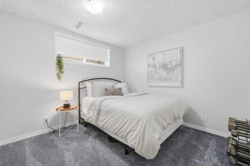 91 Bridleridge Crescent Sw, Calgary, AB - Indoor Photo Showing Bedroom