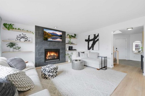 91 Bridleridge Crescent Sw, Calgary, AB - Indoor Photo Showing Living Room With Fireplace