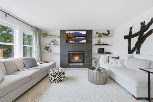 91 Bridleridge Crescent Sw, Calgary, AB - Indoor Photo Showing Living Room With Fireplace