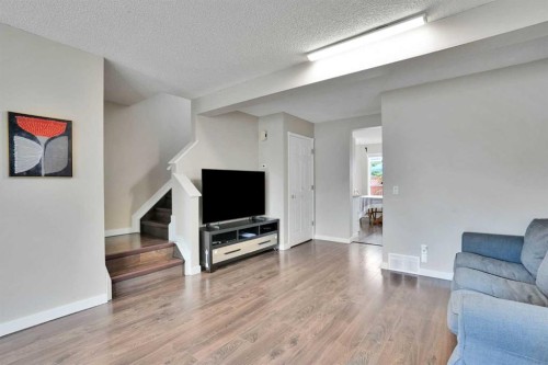 67 Somervale Drive Sw, Calgary, AB - Indoor Photo Showing Living Room