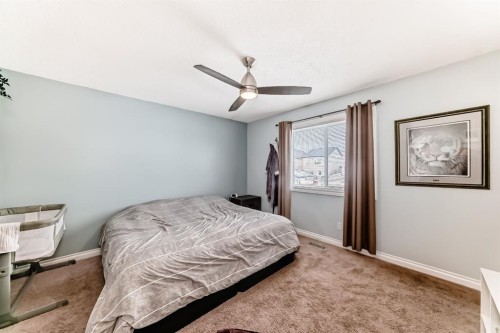 10 Reunion Grove Nw, Airdrie, AB - Indoor Photo Showing Bedroom
