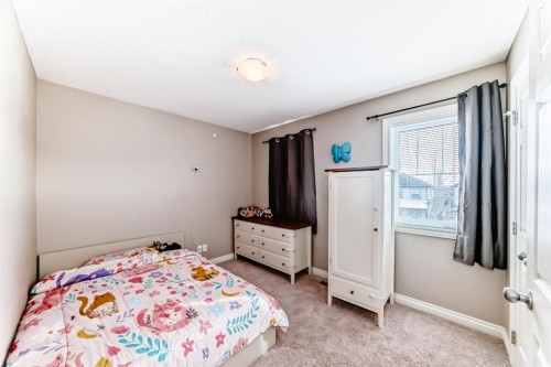10 Reunion Grove Nw, Airdrie, AB - Indoor Photo Showing Bedroom