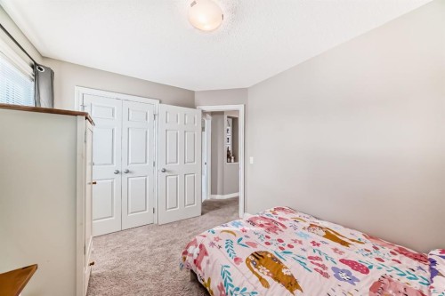 10 Reunion Grove Nw, Airdrie, AB - Indoor Photo Showing Bedroom