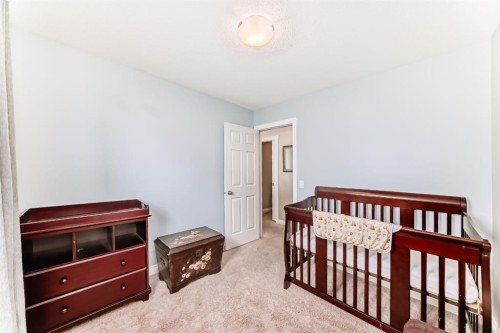 10 Reunion Grove Nw, Airdrie, AB - Indoor Photo Showing Bedroom