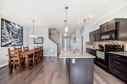 10 Reunion Grove Nw, Airdrie, AB - Indoor Photo Showing Kitchen With Upgraded Kitchen