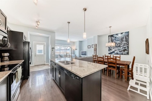 10 Reunion Grove Nw, Airdrie, AB - Indoor Photo Showing Kitchen With Double Sink With Upgraded Kitchen