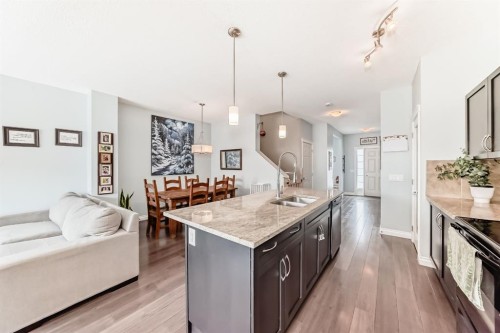 10 Reunion Grove Nw, Airdrie, AB - Indoor Photo Showing Kitchen With Double Sink With Upgraded Kitchen