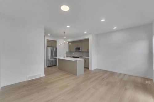 7 Heritage Heath, Cochrane, AB - Indoor Photo Showing Kitchen