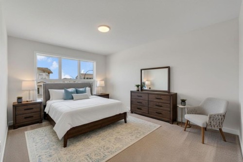 7 Heritage Heath, Cochrane, AB - Indoor Photo Showing Bedroom