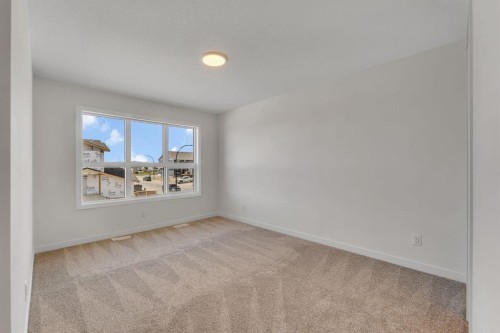 7 Heritage Heath, Cochrane, AB - Indoor Photo Showing Other Room