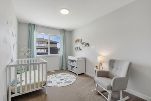 7 Heritage Heath, Cochrane, AB - Indoor Photo Showing Bedroom