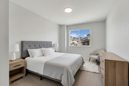7 Heritage Heath, Cochrane, AB - Indoor Photo Showing Bedroom