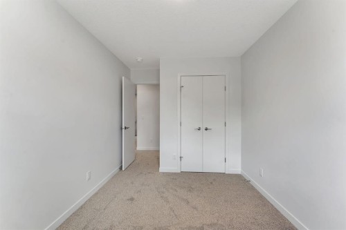 7 Heritage Heath, Cochrane, AB - Indoor Photo Showing Other Room