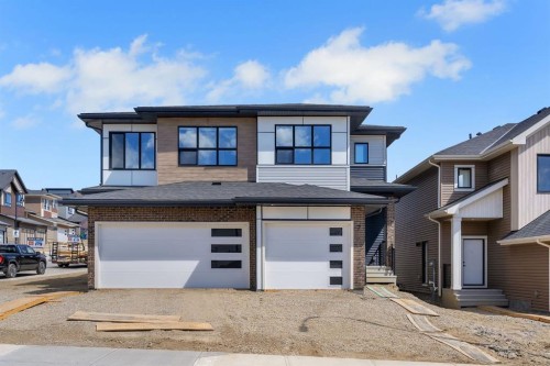 7 Heritage Heath, Cochrane, AB - Outdoor With Facade