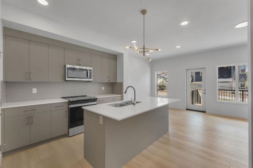 7 Heritage Heath, Cochrane, AB - Indoor Photo Showing Kitchen With Double Sink