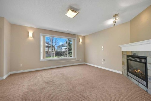 8 Valley Creek Crescent Nw, Calgary, AB - Indoor With Fireplace