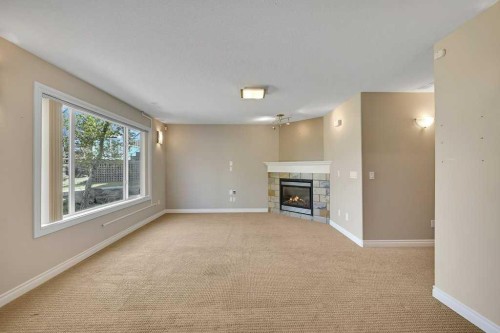 8 Valley Creek Crescent Nw, Calgary, AB - Indoor With Fireplace