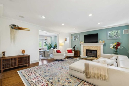 3013 Montcalm Crescent Sw, Calgary, AB - Indoor Photo Showing Living Room With Fireplace