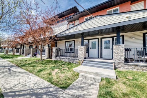 173 Eversyde Common Sw, Calgary, AB - Outdoor With Deck Patio Veranda With Facade