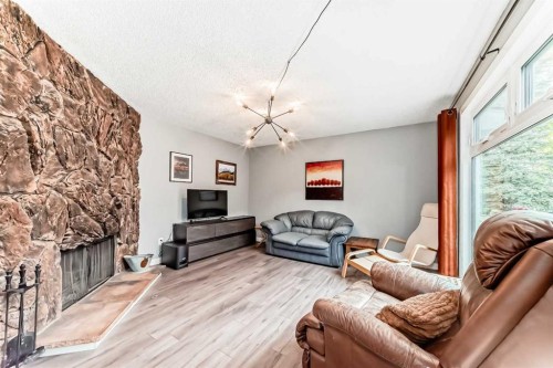 6739 Coach Hill Road Sw, Calgary, AB - Indoor Photo Showing Living Room With Fireplace