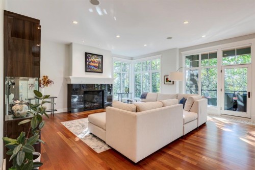 124 Posthill Drive Sw, Calgary, AB - Indoor Photo Showing Living Room With Fireplace