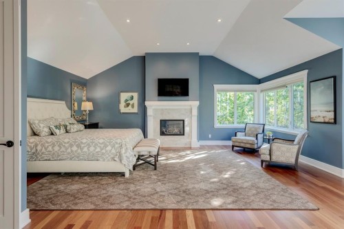 124 Posthill Drive Sw, Calgary, AB - Indoor Photo Showing Bedroom With Fireplace