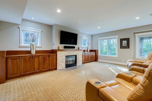 124 Posthill Drive Sw, Calgary, AB - Indoor Photo Showing Living Room With Fireplace
