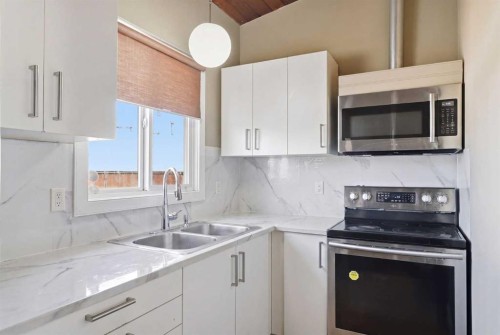 416 Pinemont Gate Ne, Calgary, AB - Indoor Photo Showing Kitchen With Double Sink