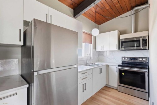 416 Pinemont Gate Ne, Calgary, AB - Indoor Photo Showing Kitchen With Stainless Steel Kitchen With Double Sink