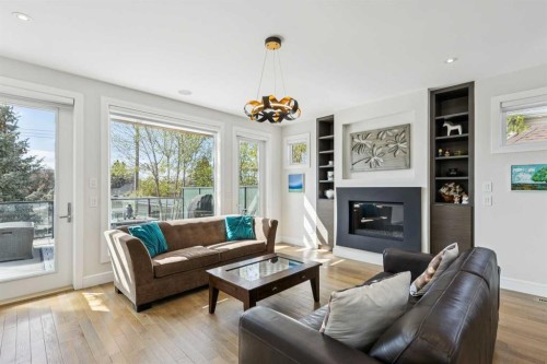 911 Drury Avenue Ne, Calgary, AB - Indoor Photo Showing Living Room With Fireplace