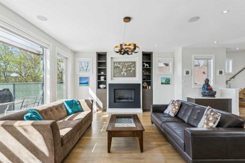 911 Drury Avenue Ne, Calgary, AB - Indoor Photo Showing Living Room With Fireplace