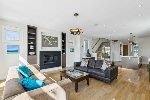 911 Drury Avenue Ne, Calgary, AB - Indoor Photo Showing Living Room With Fireplace