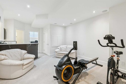 911 Drury Avenue Ne, Calgary, AB - Indoor Photo Showing Gym Room