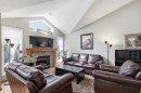 69 Chaparral Villas Se, Calgary, AB  - Indoor Photo Showing Living Room With Fireplace 