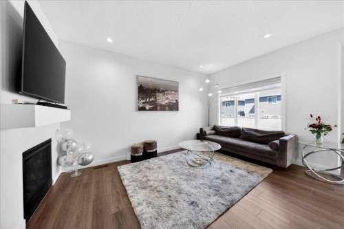 44 Saddlestone Way Ne, Calgary, AB - Indoor Photo Showing Living Room With Fireplace