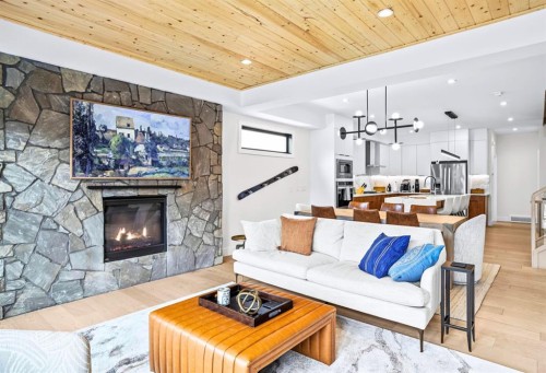 1-826 7Th Street, Canmore, AB - Indoor Photo Showing Living Room With Fireplace