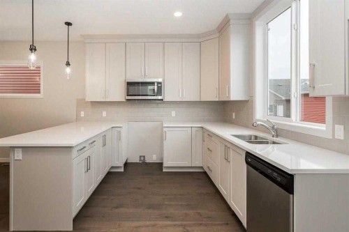 504 Kitstone Gate, Carstairs, AB - Indoor Photo Showing Kitchen With Double Sink