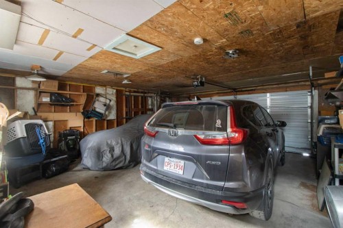 1622 Strathcona Street, Crossfield, AB - Indoor Photo Showing Garage
