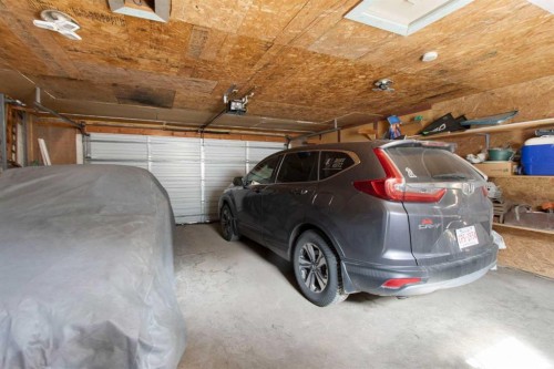 1622 Strathcona Street, Crossfield, AB - Indoor Photo Showing Garage