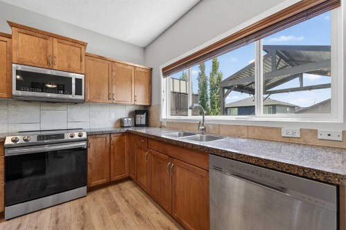 52 Reunion Close Nw, Airdrie, AB - Indoor Photo Showing Kitchen With Stainless Steel Kitchen With Double Sink