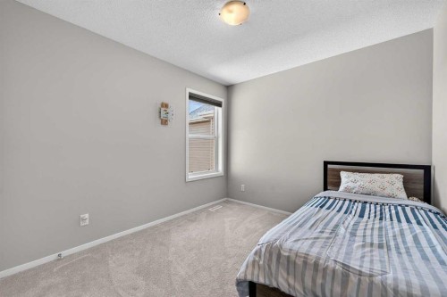52 Reunion Close Nw, Airdrie, AB - Indoor Photo Showing Bedroom