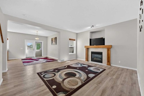 52 Reunion Close Nw, Airdrie, AB - Indoor Photo Showing Living Room With Fireplace