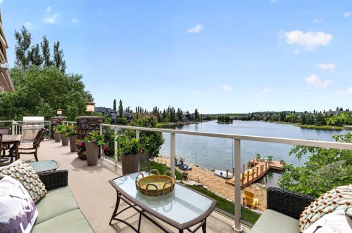 128 Heritage Lake Drive, Heritage Pointe, AB - Outdoor With Body Of Water With Deck Patio Veranda